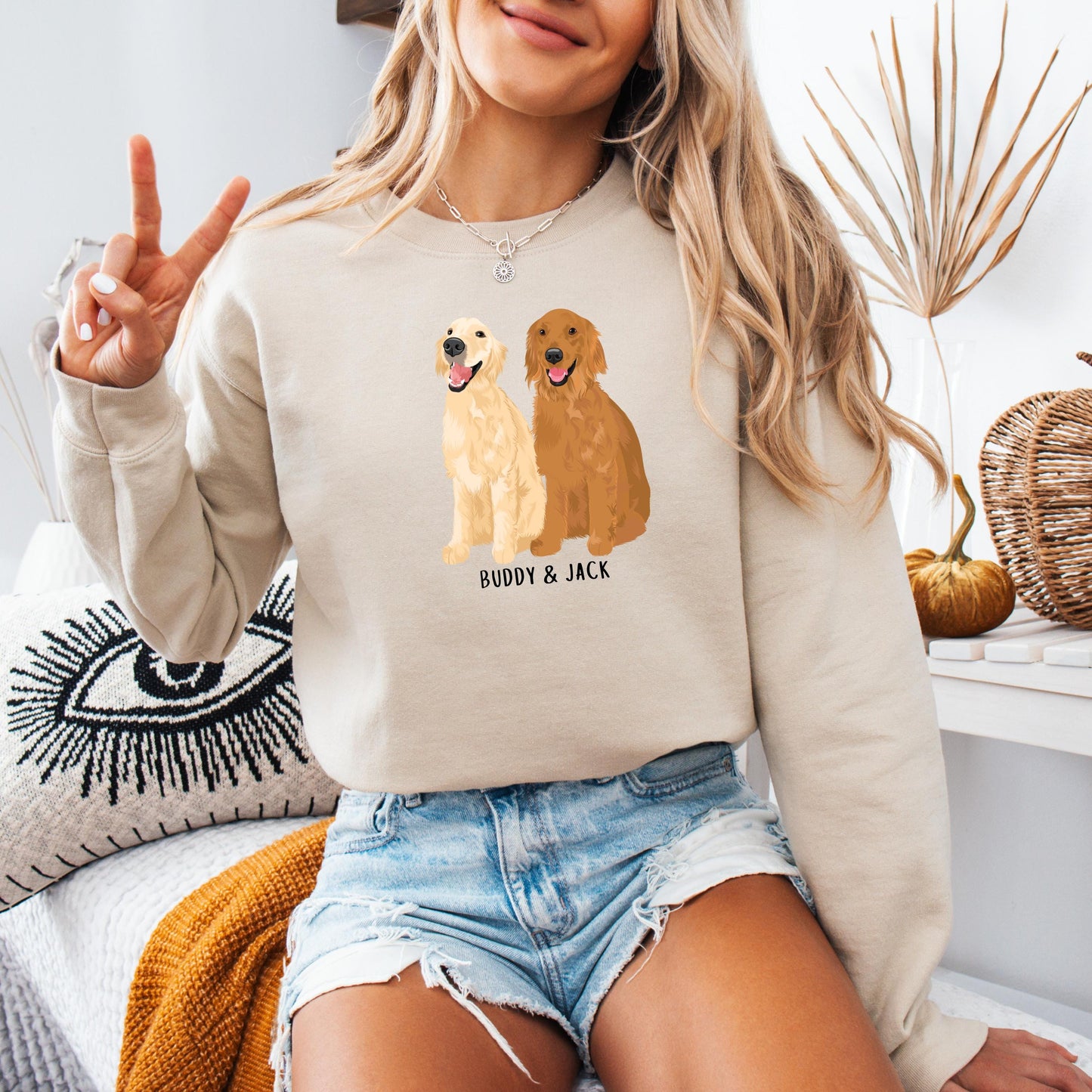 A woman wearing a personalized golden retriever sweatshirt