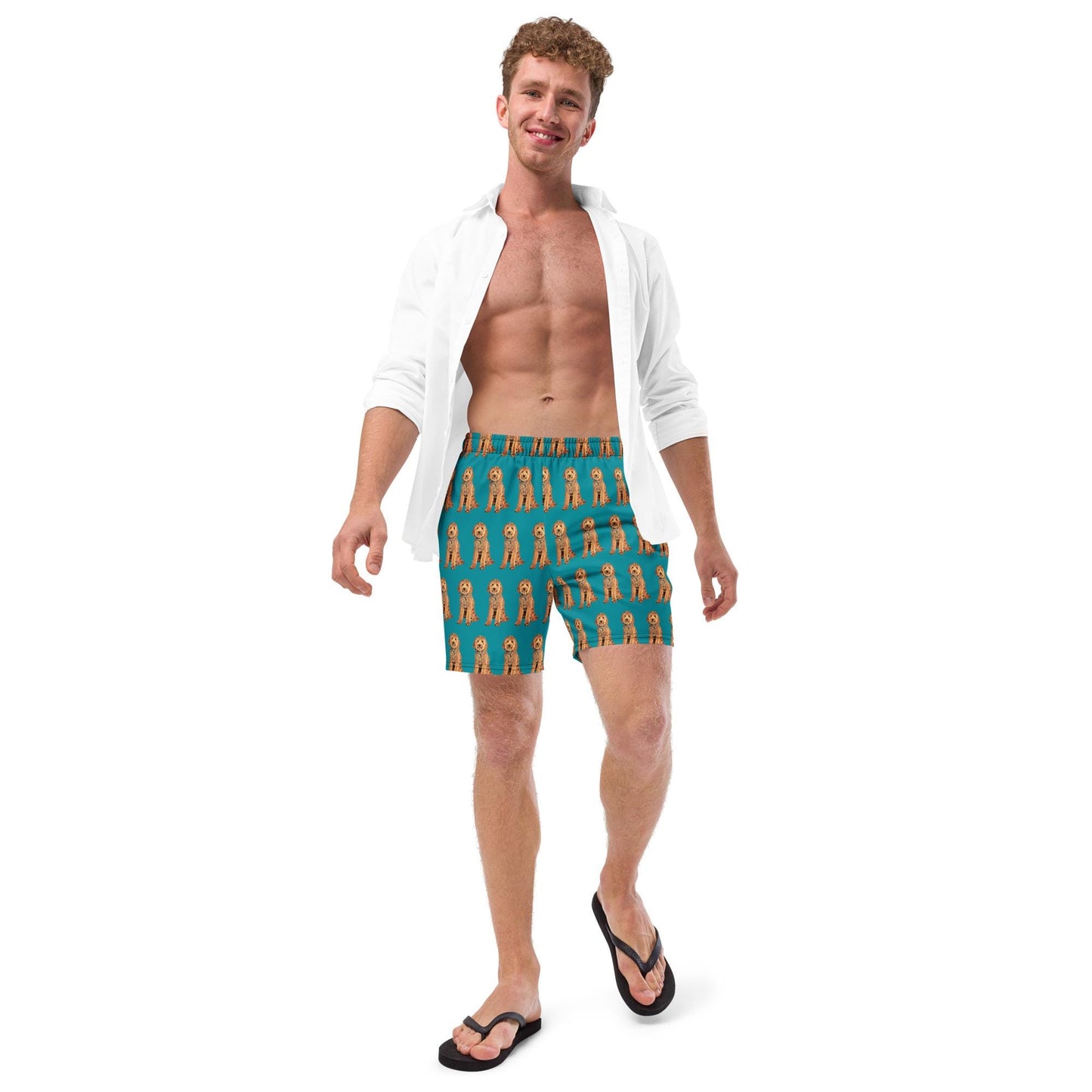 A man wearing a goldendoodle pattern swim trunks