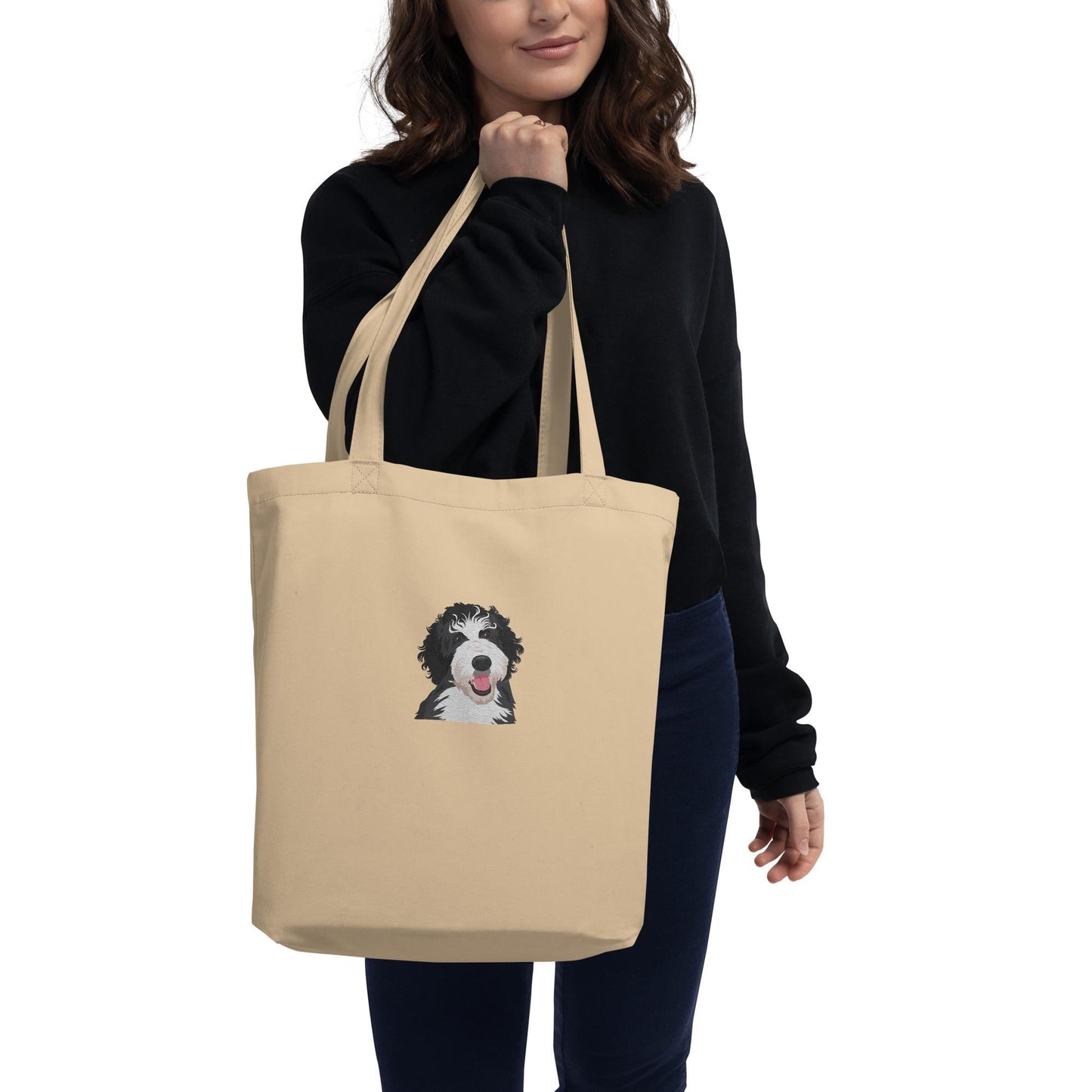 A Woman Holding a Bernedoodle Eco Tote Bag