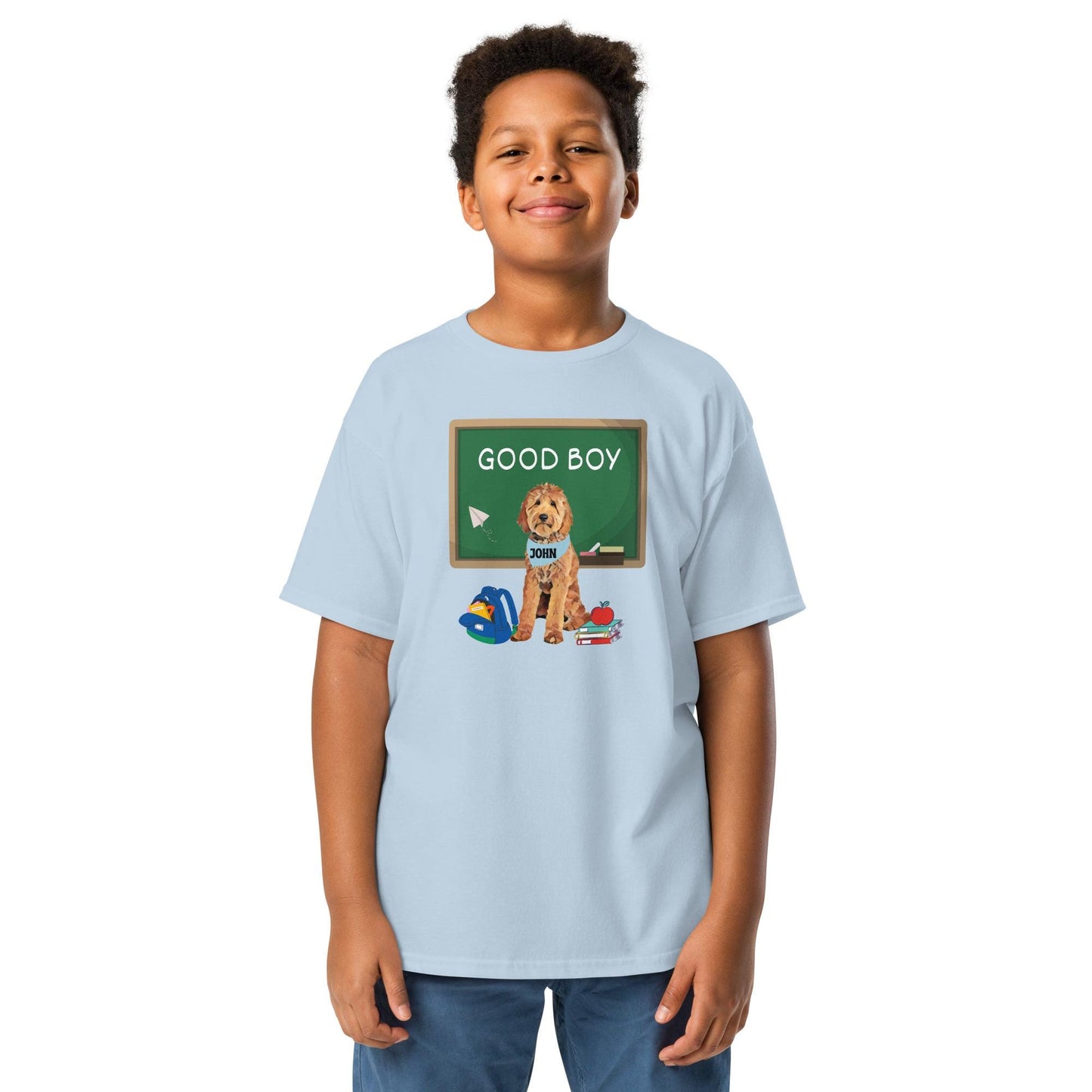 A boy wearing a "Good boy" Goldendoodle youth T-shirt in color light blue.