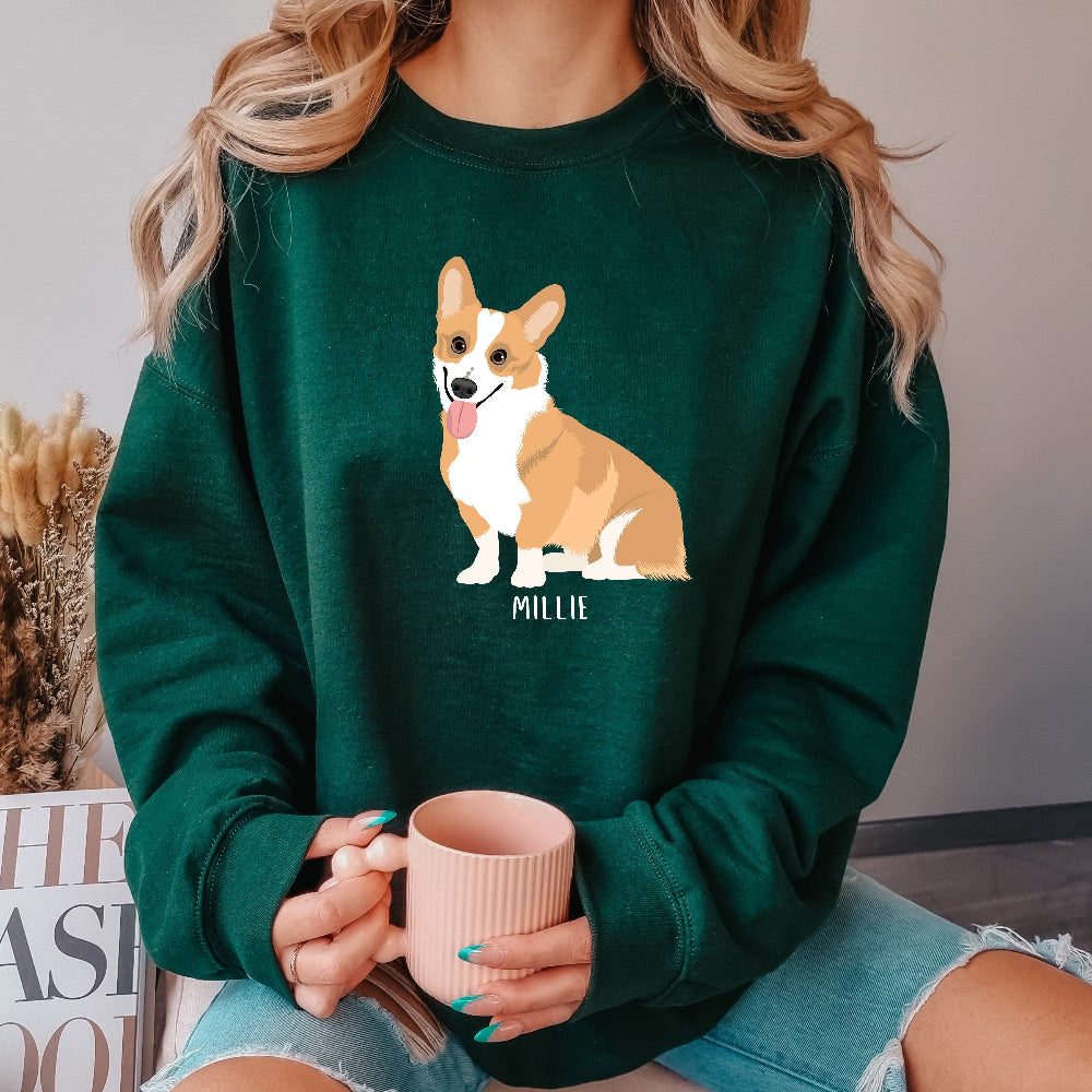 Personalized corgi sweatshirt in forest green. Features corgi and graphics with custom name.