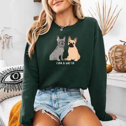 A dog mom wearing a personalized French Bulldog sweatshirt  in color forest green with grey frenchie and a tan frenchie, and their names underneath the dog graphic