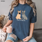 A woman wearing a personalized dog mom t-shirt in color denim with two french bulldog graphics and  dog names