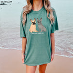 A dog mom wearing a personalized French bulldog T-Shirt in color seafoam from Love Dogs Gifts