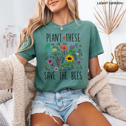 A woman wearing a cottagecore aesthetic shirt with plant these save the bees shirt design