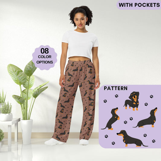 A woman wearing a tan Dachshund pajama pants