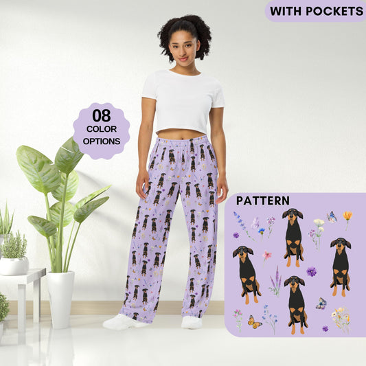 A woman wearing a wildflower doberman pajama pants for women and men