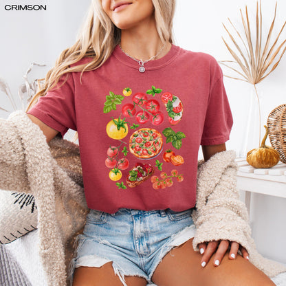A woman wearing a farm fresh tomatoe shirt