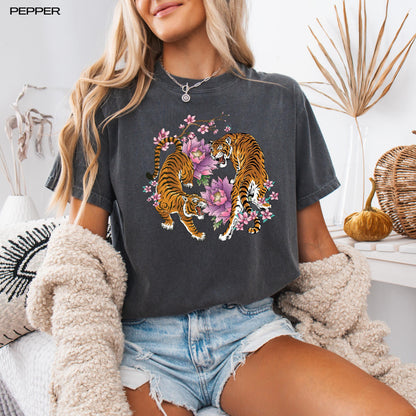 A woman wearing a unisex floral tiger sakura shirt