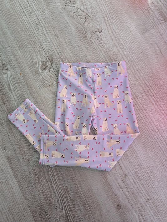 a flatlay view of a yellow labrador puppy leggings for kids