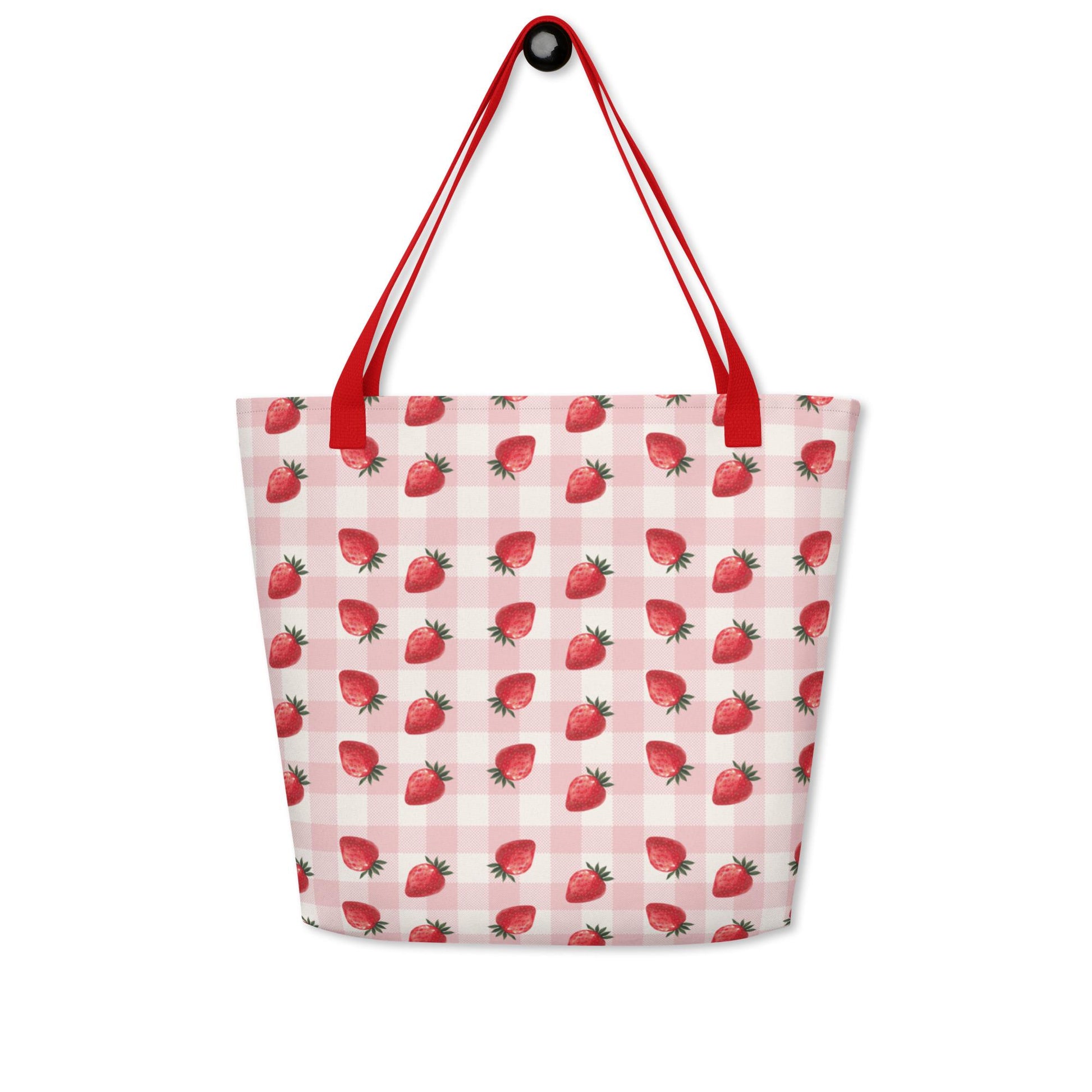 Gingham strawberry summer tote bag hanged on a hook