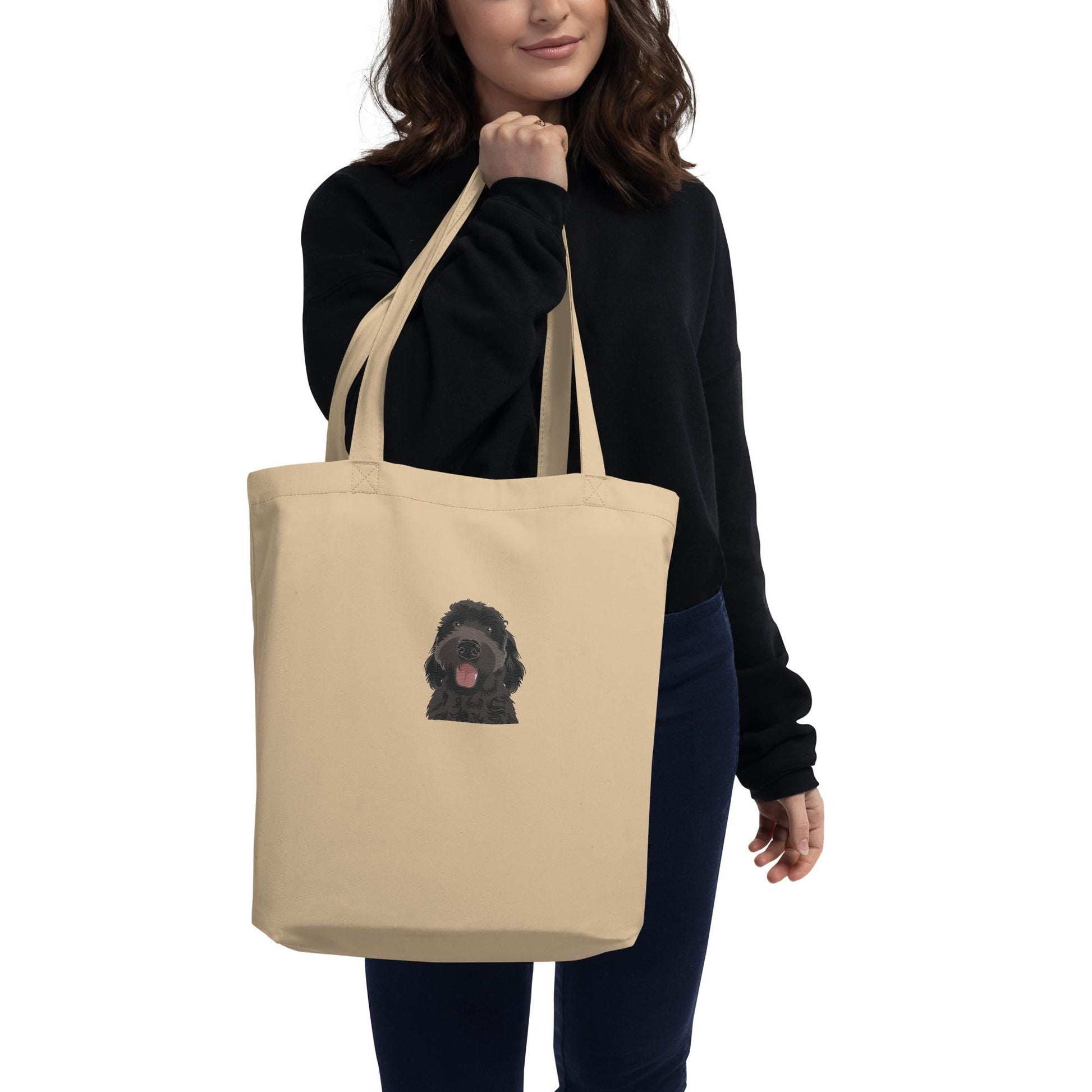 A woman wearing a black goldendoodle eco tote