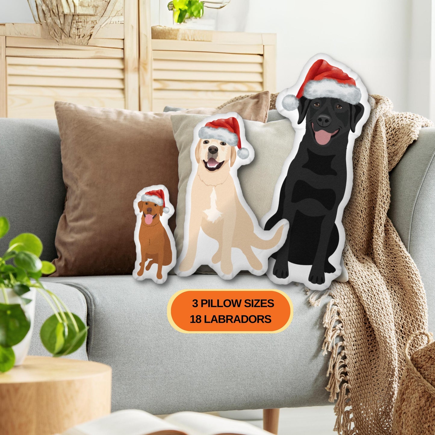 Christmas Hat Labrador Pillow: Kids Nursery Decor with 3 Labrador pillows wearing Santa hats on a sofa.