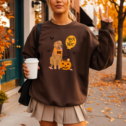 A woman wearing a Trick or Treat Golden Retriever Sweatshirt in the fall season 2025 trendiest color chocolate