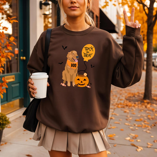 A woman wearing a Trick or Treat Golden Retriever Sweatshirt in the fall season 2025 trendiest color chocolate